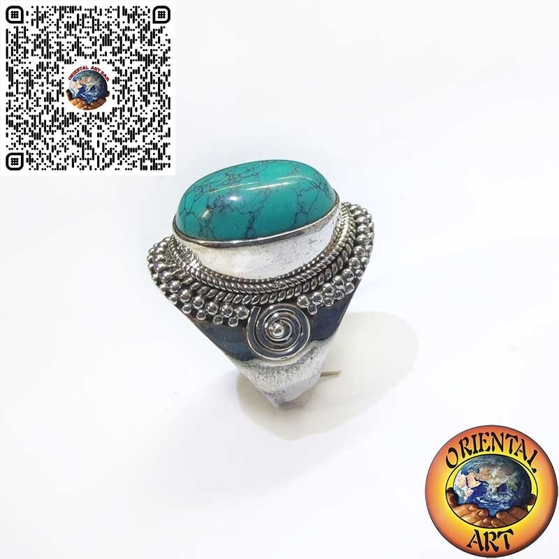Silver ring with cabochon turquoise decorated with intertwining and spiral
