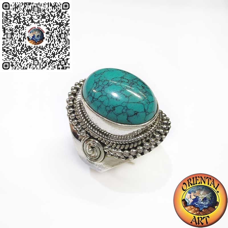 Silver ring with cabochon turquoise decorated with intertwining and spiral