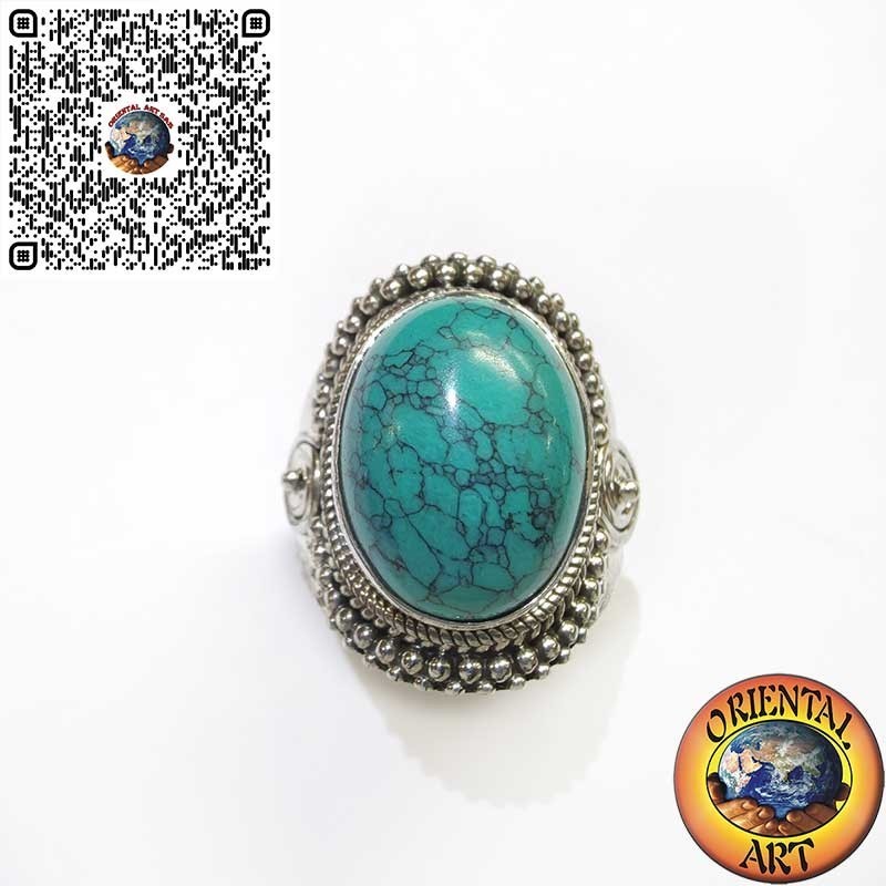 Bague en argent avec cabochon turquoise orné d'entrelacs et de spirale