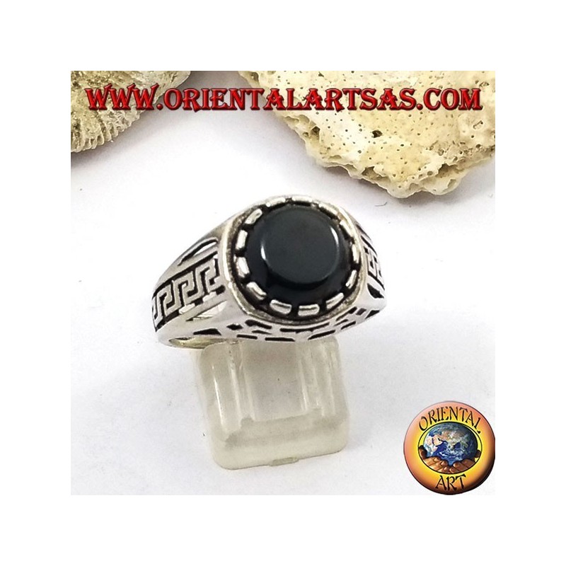 Silver ring with flat round onyx and perforated ribs on the sides