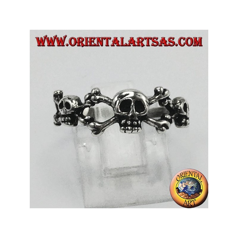 Silver ring with three skulls with bone