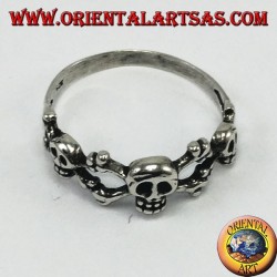 Silver ring with three skulls with bone