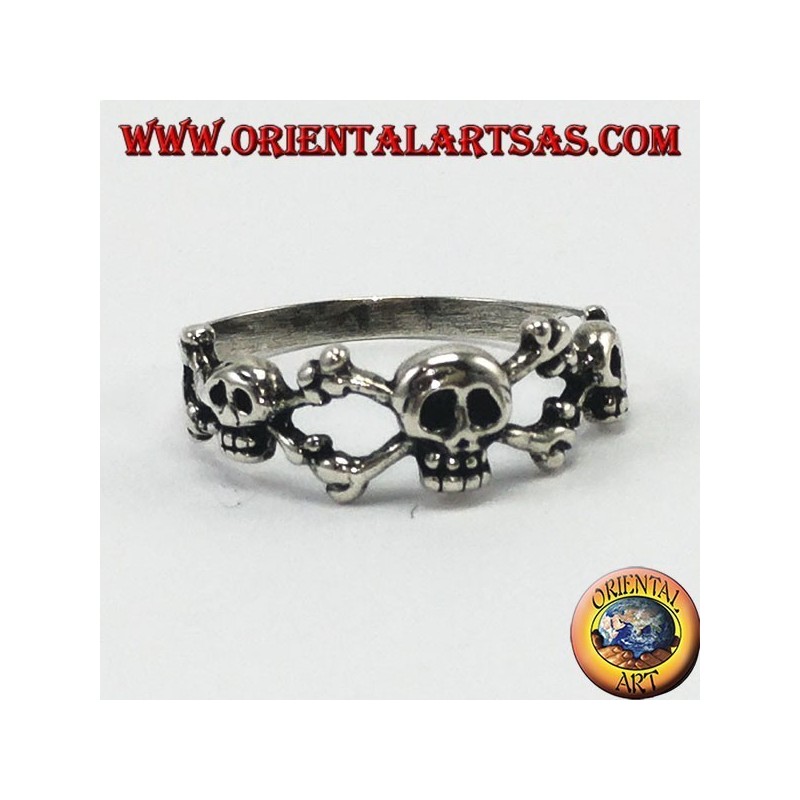 Silver ring with three skulls with bone